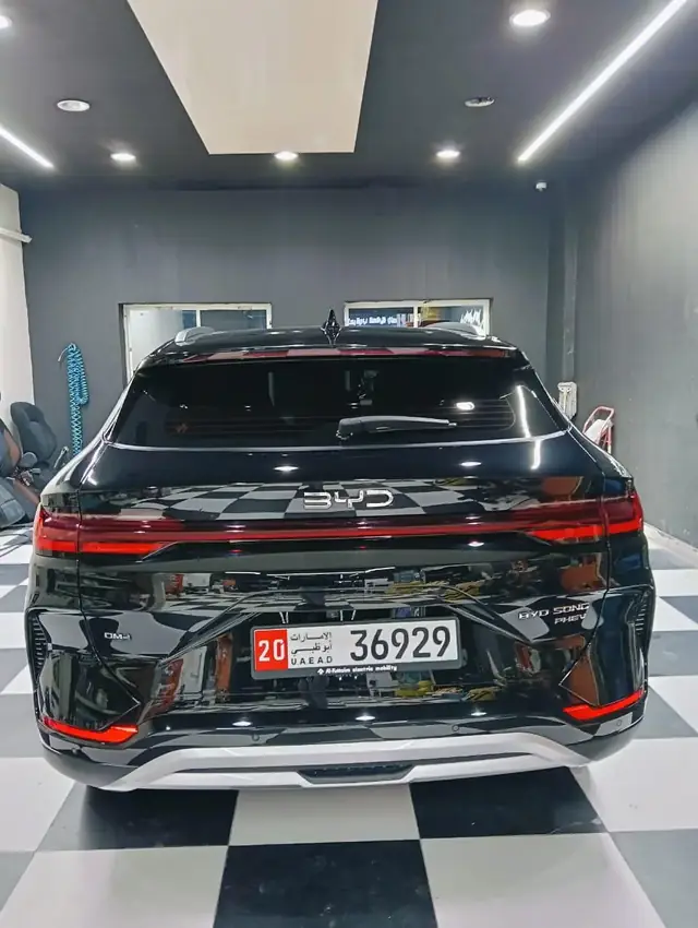 Black BYD Song SUV rear view with Abu Dhabi plates