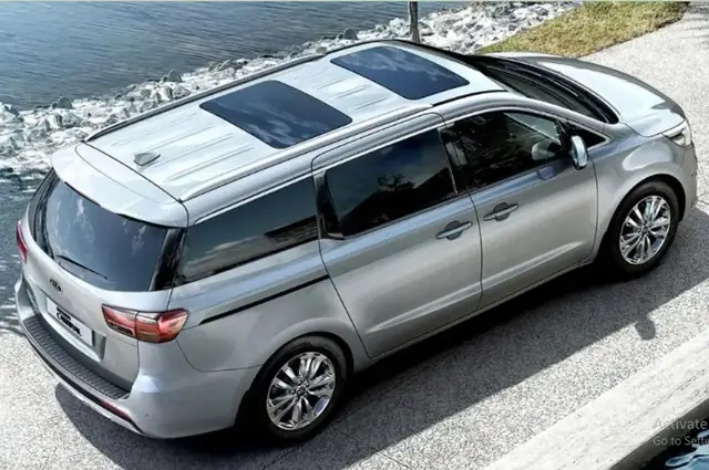 Silver Kia Carnival 7-seater — actual Carpools UAE fleet car