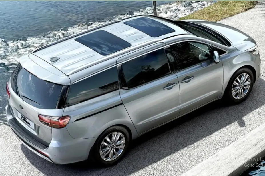 Silver Kia Carnival 7-seater — actual Carpools UAE fleet car